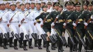 Members of an honour guard march during a welcome ceremony for Portuguese President Anibal Cavaco Silva held by Chinese President Xi Jinping outside the Great Hall of the People on 15 May 2014 in Beijing.