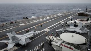 US planes on the flight deck of USS George Washington. Photo: 15 June 2014