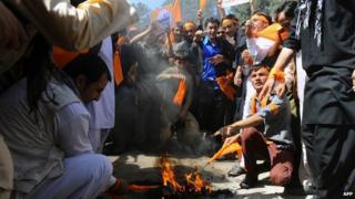 Afghan students set fire to voter registration cards in protest at alleged election fraud in Herat 22/06/2014