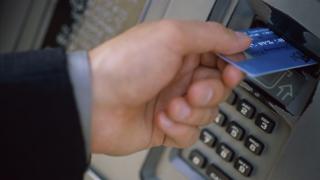 Man using cash card