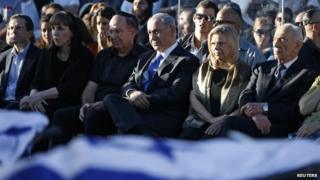 Israeli Prime Minister Benjamin Netanyahu (3rd R, front) and his wife Sara (2nd R, front), Defence Minister Moshe Yaalon (3rd L, front) and President Shimon Peres (R, front) attend the joint funeral of the three Israeli teens who were abducted and killed in the occupied West Bank, in the Israeli city of Modein, 1 July 2014
