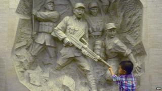 A boy visits China's Anti-Japanese War museum in west Beijing