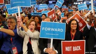 Supporters hold up signs at the Democratic National Convention in 2012.