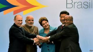 (L to R) Russian President Vladimir Putin, India"s PM Narendra Modi, Brazilian President Dilma Rousseff, China"s President Xi Jinping and South Africa"s Jacob Zuma gesture during the 6th BRICS Summit in Fortaleza, Brazil, on July 15, 2014.