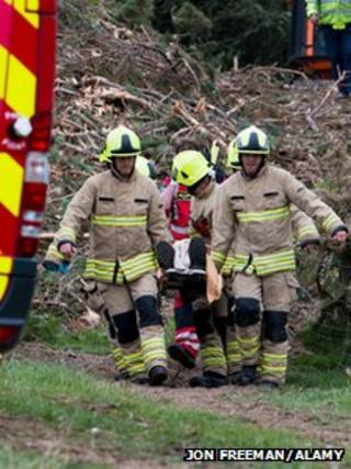 Firefighters carrying the injured man