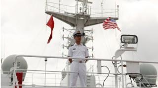 A guard keeps media out of a restricted area as they tour the Peoples Liberation Army Naval Hospital ship Peace Ark at Joint Base Pearl Harbor Hickam in Honolulu, Hawaii, on 5 July 2014.