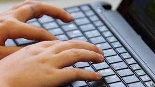 Man typing on keyboard