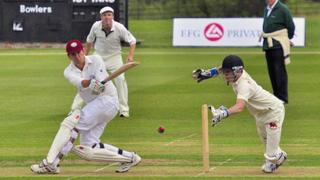 Damien Lewis looks on as Peter Frankopan strikes the ball