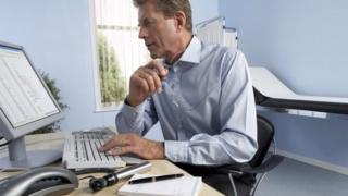 Doctor checks computer screen