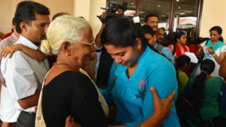 Nurses returning from Libya at the Kochi airport
