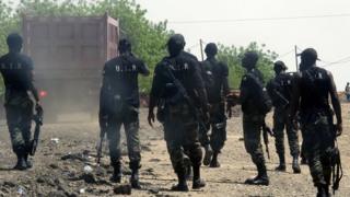 Armed Cameroonian men of the rapid intervention battalion (BIR) patrol on 29 May 2014 in Waza, northern Cameroon.