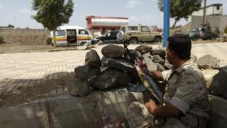 An army soldier mans a checkpoint in the Yemeni capital Sanaa on 17 May 2014.
