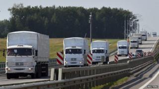 Convoy of white trucks
