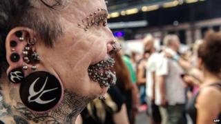 Rolf Buchholz, the worlds most pierced man, attends a tattoo convention in Berlin on 2 August 2014.
