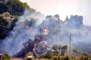 Fire engines near the crash site in the Marche region of eastern Italy, 19 August