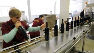 Wine being bottled and packaged at a winery in Tbilisi