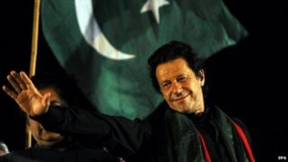 Imran Khan waves to supporters at a mass anti-government protest in Islamabad - 20 August 2014