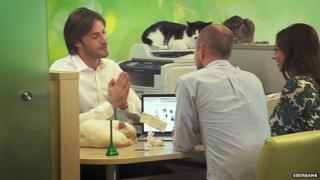 Customers select a cat in a Sberbank promotional video