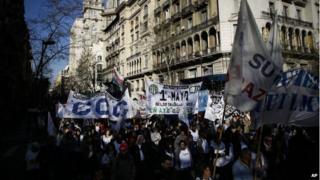 People march towards the Congress during a protest in Buenos Aires on 27 August 2014