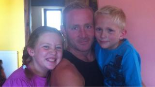 Matthew Thompson with his children