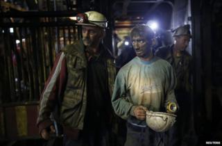 Surviving miners leave the Raspotocje coal mine in Zenica, 5 September