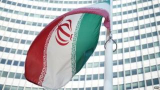 An Iranian flag waves in a wind outside the Vienna International Centre in July 2014