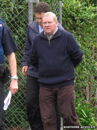 Michael Harris is led to Kaitaia police station on 10 September 2014