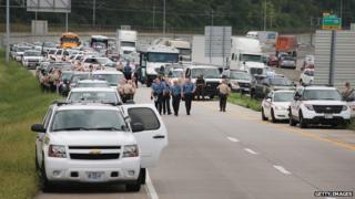 Police vehicles fill an off ramp along Interstate Highway 70 as they try to prevent demonstrators from entering the highway on September 10, 2014 near Ferguson, Missouri