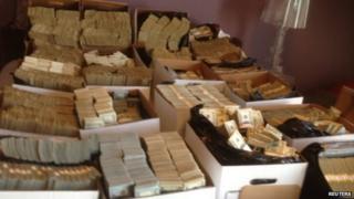 Boxes containing US currency seized during a raid in the Los Angeles Fashion District are seen in an undated handout photo released by the US Department of Justice on 10 September, 2014.