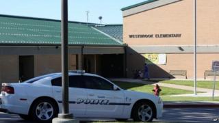 A police car is parked in front of Westbrook Elementary School in Taylorsville, Utah, 11 September 2011
