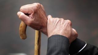 A pensioner holds his walking stick in September 2014 in Walsall