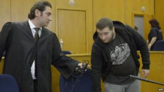 Kreshnik Berisha (left) and his defence lawyer in court. Photo: 15 September 2014