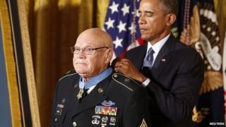 US President Barack Obama awards the Medal of Honor to Army Command Sergeant Major Bennie G. Adkins for actions during the Vietnam War while in the East Room of the White House in Washington, 15 September 2014