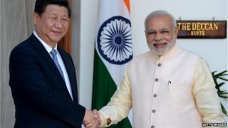 Chinese President Xi Jinping (left) and Indian Prime Minister Narendra Modi