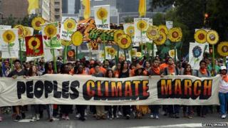 Climate-change activists march through the streets of New York City on 21 September, 2014.