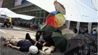 Pro-democracy protesters take a rest during the mass civil disobedience campaign Occupy Central in Mong Kok shopping area, Hong Kong, China, 8 October 2014.