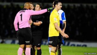 Jason Brown talks to referee
