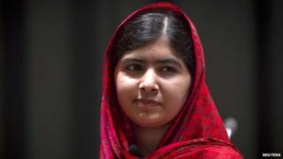 Pakistani schoolgirl activist Malala Yousafzai poses for pictures during a photo opportunity in