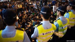 Media in China defend Hong Kong's police force after reported scuffles between officers and pro-democracy protesters.