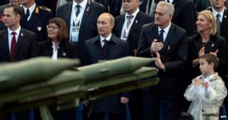 Russian President Vladimir Putin (centre) watches parade in Belgrade, 16 October