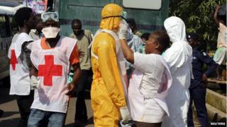 Health workers in Freetown, Sierra Leone, on 14 October 2014