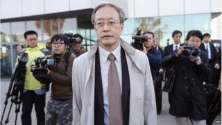 Junichi Ihara, centre, director general of the Asia and Oceania affairs bureau of Japanese Foreign Ministry, arrives at the Sunan International Airport, Monday, Oct. 27, 2014 in Pyongyang, North Korea