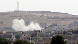 Smoke rises in Kobane, north Syria, after an air strike