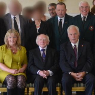 Elaine Hampton (L), Robert Graham, Stephen McAlister, Billy Allen and Gordon Knowles (R) pictured with Irish President Michael D Higgins
