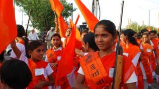 Chinmayee poses with a gun