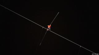 Nik Wallenda walks on a wire