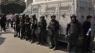 Egyptian security forces stand guard at Cairo University in Cairo, Egypt, on 12 October 2014