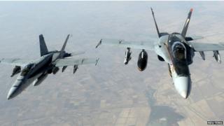U.S. Navy F-18E Super Hornet jets leave to support military operations against ISIL after receiving fuel from a KC-135 Stratotanker over Iraq 11 August 2014