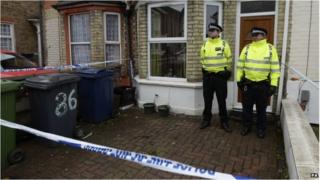 Officers outside a house in Desborough Avenue, High Wycombe