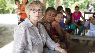 Liz Crew meeting Bolivian community to talk about how flooding affects them
